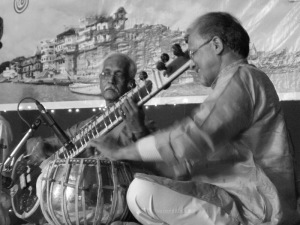  Mr. Ramu Pandit (right) playing the tabla and Mr. Rabindra Goswami (left) playing the sitar at a prior performance. Both musicians are renowned masters of north Indian classical music.
